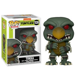 Obrazek ukazuje pudełko z figurką/zabawką Funko Pop! Movies : Wojownicze Żółwie Ninja (TMNT) - Tokka 1139 w środku, a po jego prawej znajduje się sama figurka/zabawka Funko Pop! Funko Pop! Movies: Teenage Mutant Ninja Turtles - Tokka